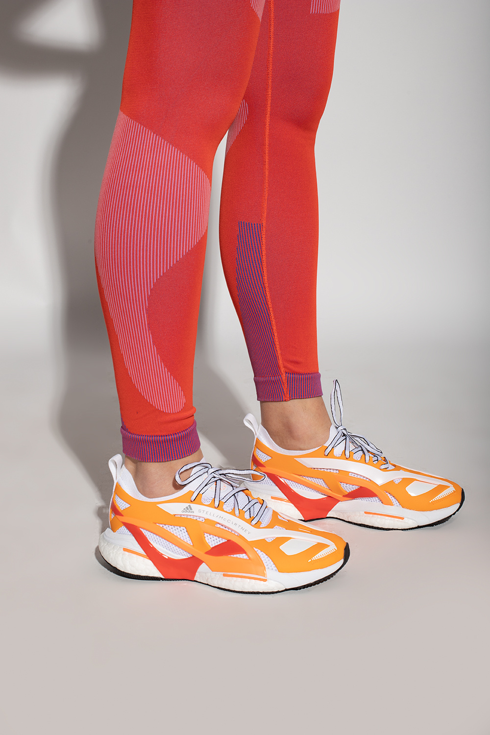 Orange 'Solarglide' running shoes ADIDAS by Stella McCartney